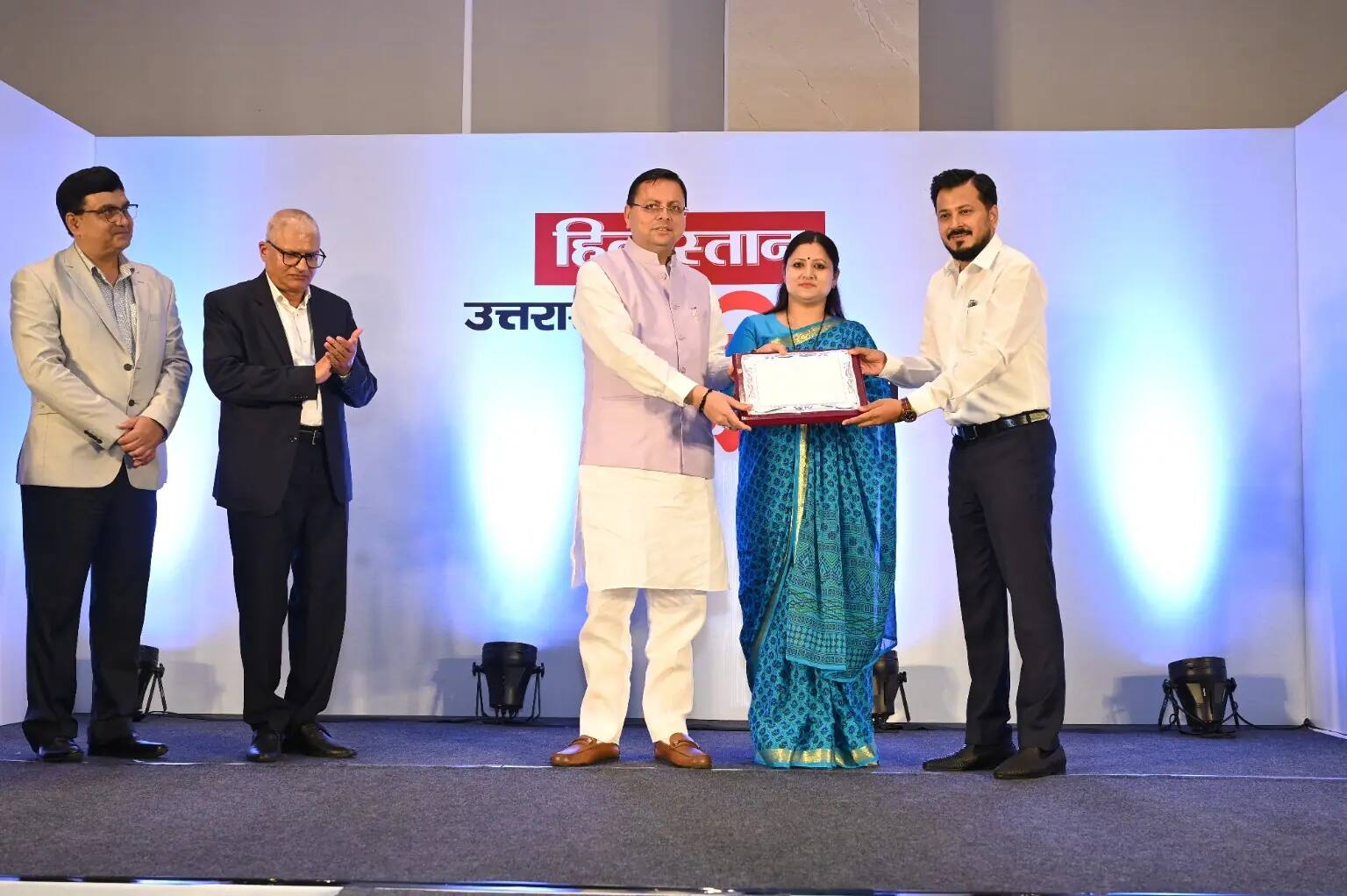 Tushar Kumar receiving the Uttarakhand Shri Samman from Chief Minister Pushkar Singh Dhami